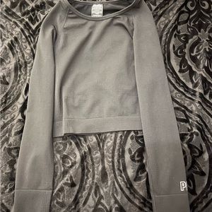 The lighting isn’t great but the shirt is a black seamless pink long sleeve